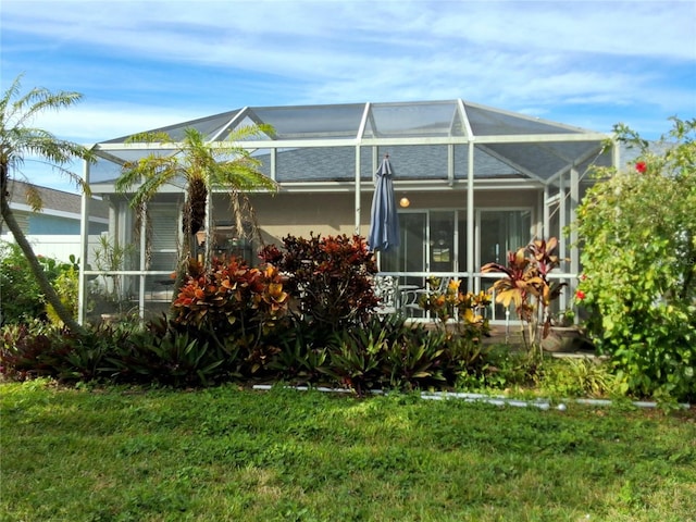 5115 44th St W, Bradenton, FL 34210 - rear view of house with a yard and a lanai