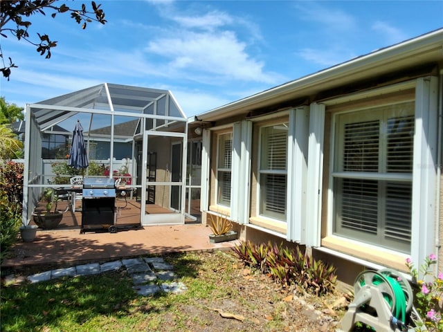 5115 44th St W, Bradenton, FL 34210 - rear view of property featuring a wooden deck and a lanai