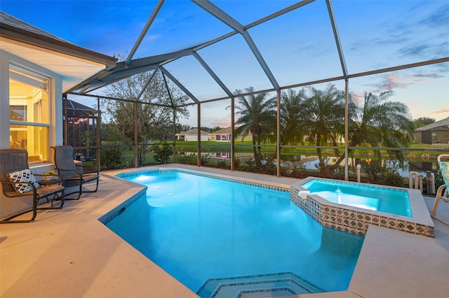 view of pool with a lanai, an in ground hot tub, a water view, and a patio