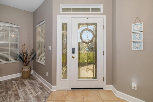 foyer entrance with light tile patterned flooring