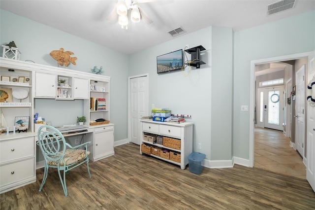 office space featuring ceiling fan and dark hardwood / wood-style flooring