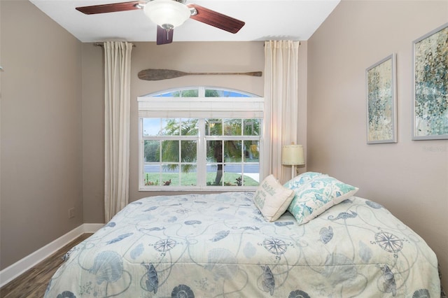 bedroom featuring ceiling fan and hardwood / wood-style flooring