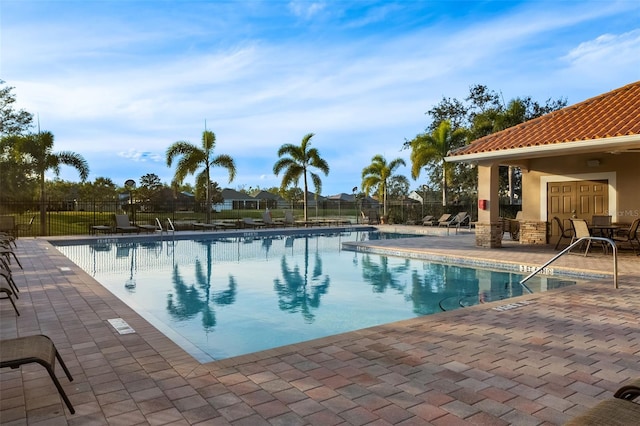 view of swimming pool with a patio