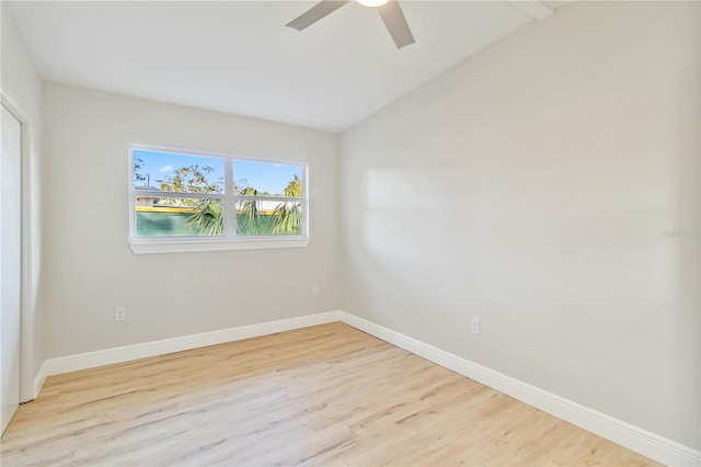 unfurnished room featuring vaulted ceiling, light hardwood / wood-style flooring, and ceiling fan