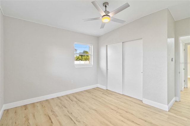 unfurnished bedroom with a closet, ceiling fan, and light hardwood / wood-style floors