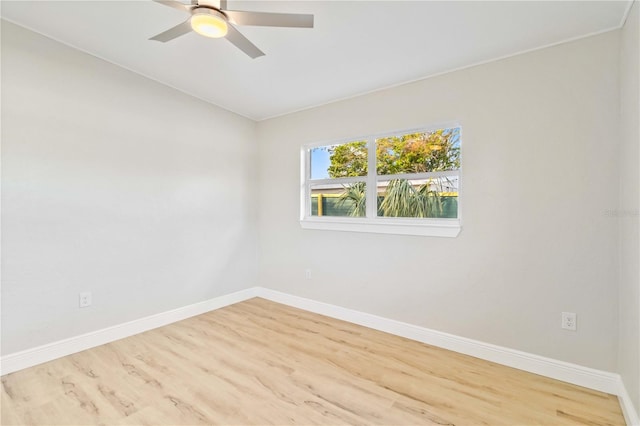 spare room featuring ceiling fan and light wood-type flooring