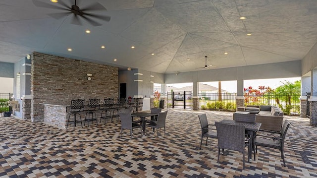 view of patio / terrace featuring an outdoor bar and ceiling fan