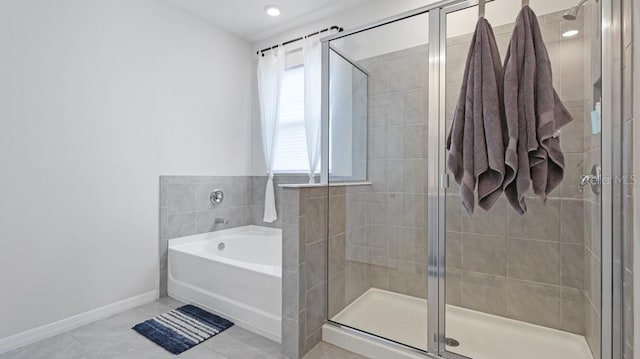 bathroom featuring tile patterned flooring and independent shower and bath