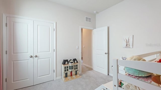 carpeted bedroom featuring a closet