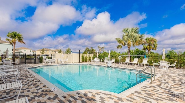 view of swimming pool featuring a patio