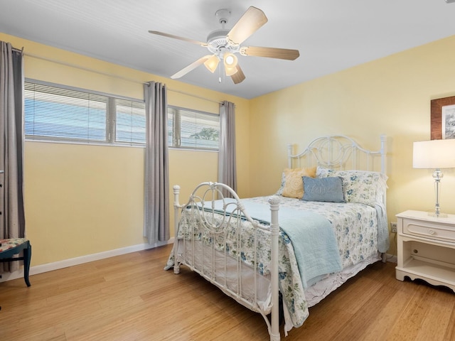 bedroom featuring ceiling fan and light hardwood / wood-style flooring