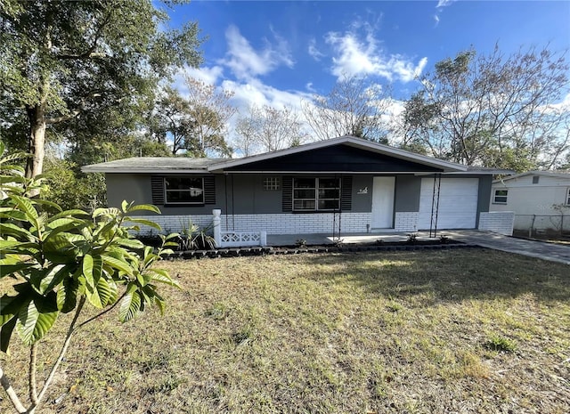 single story home with a front yard, a garage, and covered porch