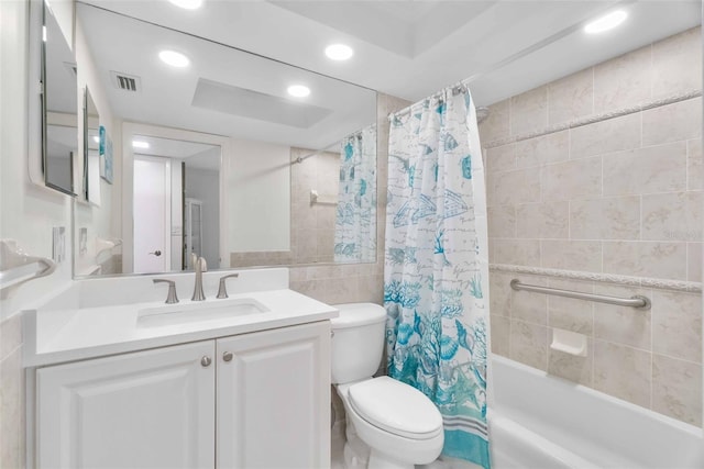 full bathroom featuring vanity, toilet, tile walls, and shower / bath combo