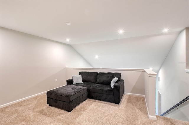 living room featuring lofted ceiling and light carpet