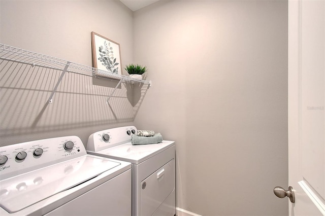 clothes washing area featuring washing machine and clothes dryer