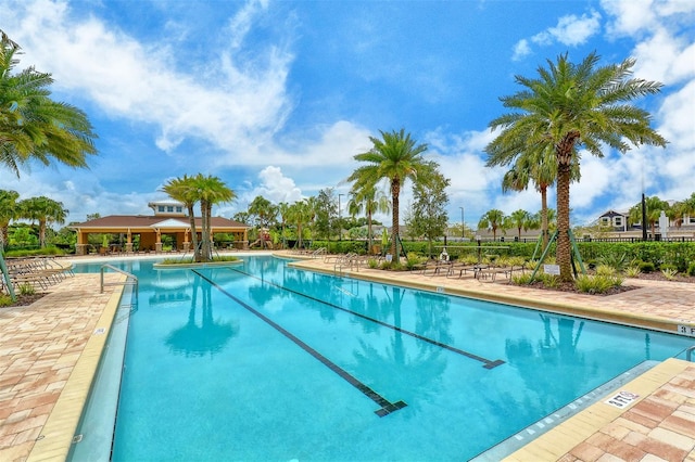 view of swimming pool featuring a patio