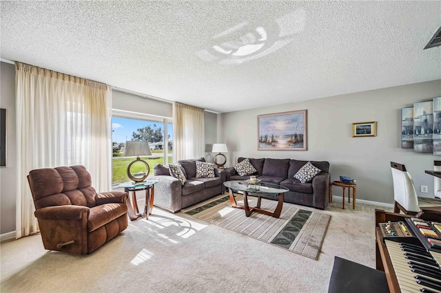 carpeted living room with a textured ceiling