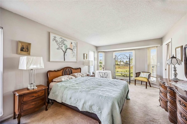 bedroom featuring carpet floors and a textured ceiling