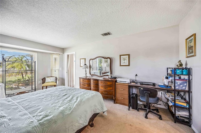 carpeted bedroom with a textured ceiling