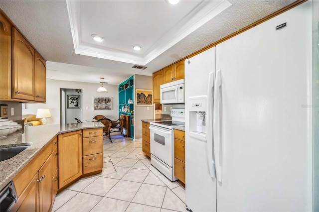 kitchen featuring kitchen peninsula, white appliances, a tray ceiling, crown molding, and hanging light fixtures