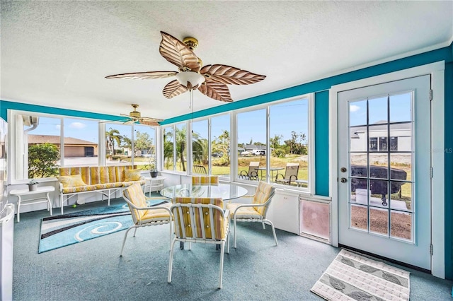 sunroom / solarium with ceiling fan