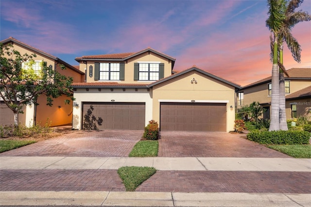 view of front of property with a garage