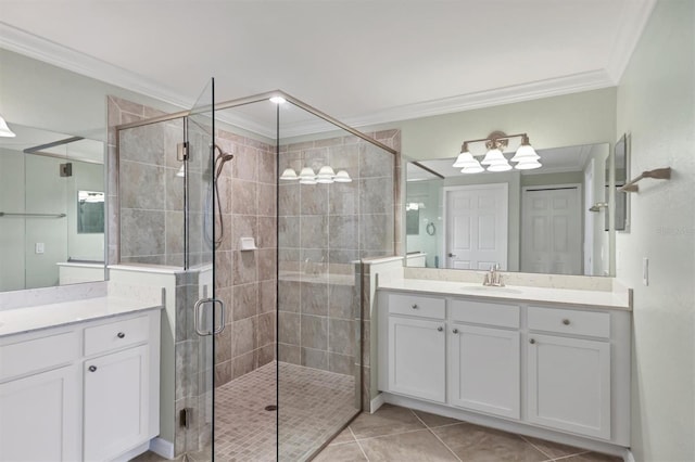 bathroom with vanity, crown molding, tile patterned floors, and walk in shower