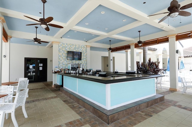 kitchen featuring coffered ceiling, tile patterned flooring, and beamed ceiling