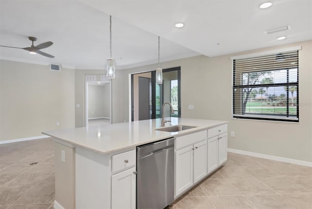 kitchen featuring pendant lighting, sink, white cabinets, stainless steel dishwasher, and a center island with sink