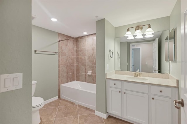 full bathroom with vanity, toilet, tiled shower / bath combo, and tile patterned flooring