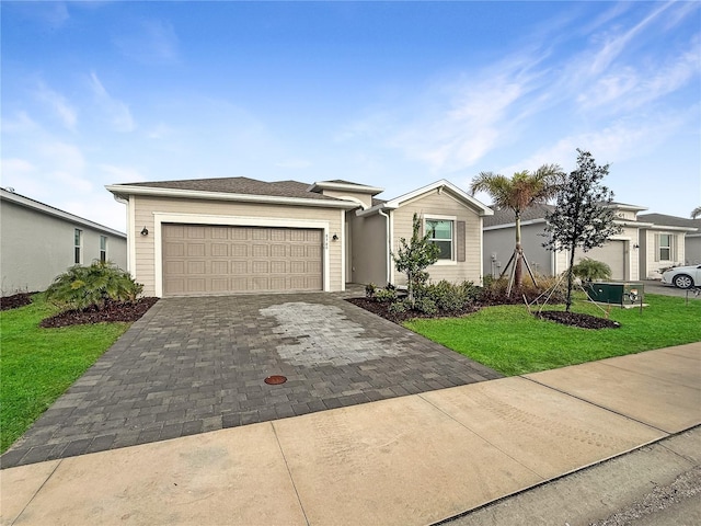 ranch-style house with a garage and a front lawn