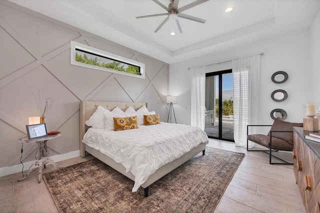 bedroom with ceiling fan, access to exterior, and light hardwood / wood-style flooring