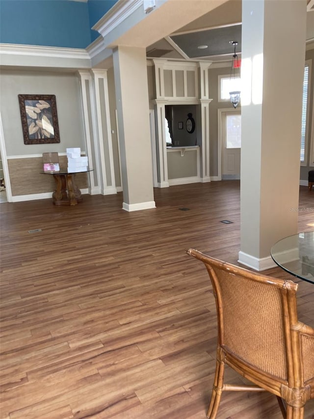 interior space featuring hardwood / wood-style flooring and ornamental molding