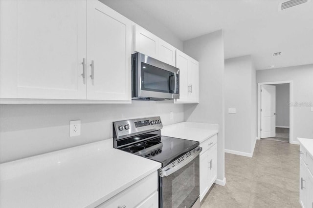 kitchen featuring white cabinets and stainless steel appliances