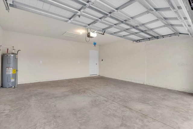 garage with water heater and a garage door opener