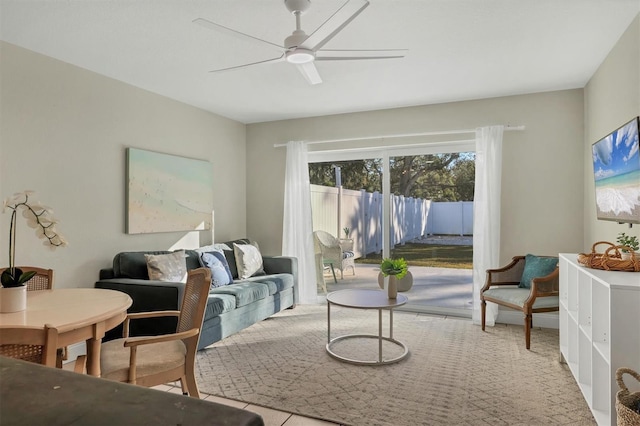 living room featuring ceiling fan and light tile patterned flooring