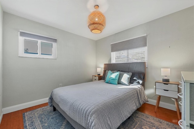 bedroom featuring dark hardwood / wood-style flooring