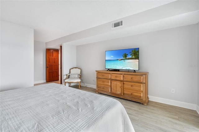 bedroom featuring light hardwood / wood-style floors