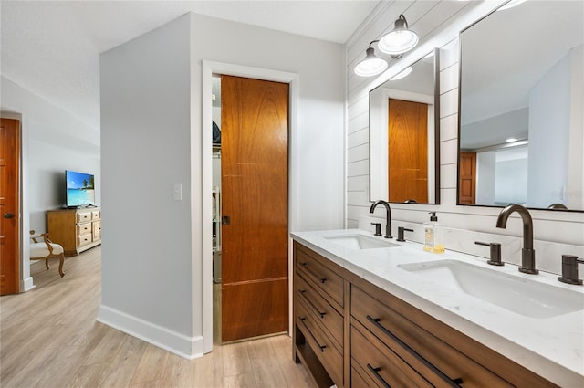 bathroom featuring hardwood / wood-style floors and vanity