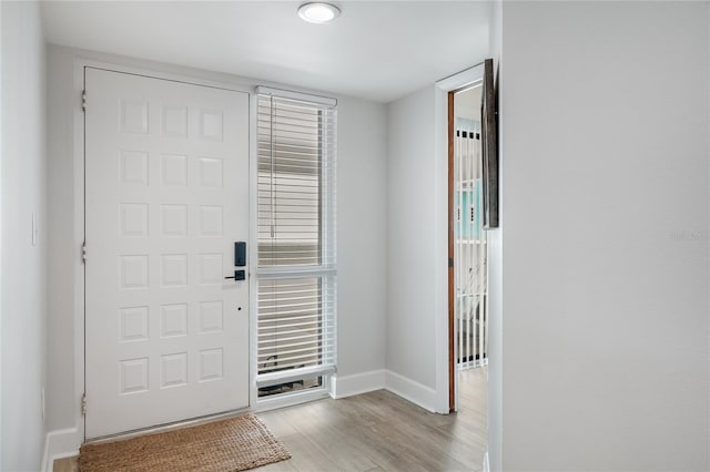 foyer entrance with light wood-type flooring