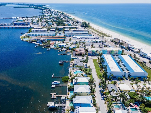 birds eye view of property featuring a view of the beach and a water view