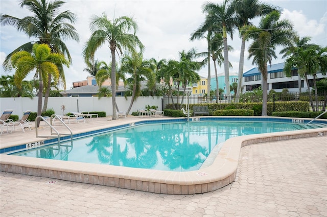 view of swimming pool with a patio