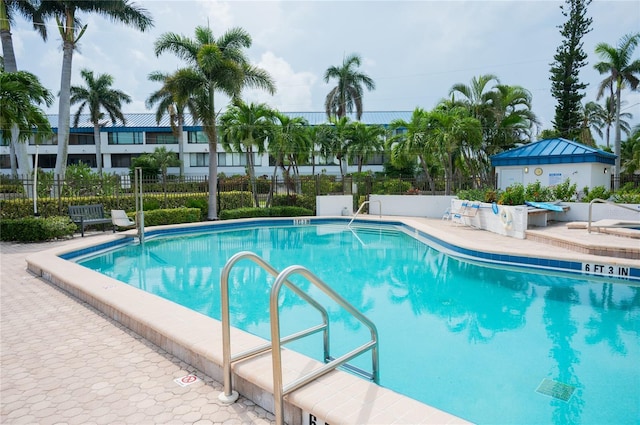 view of swimming pool featuring a patio area