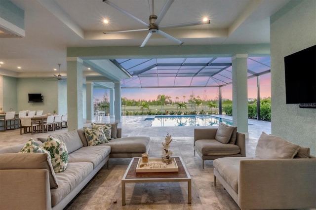 view of patio with an outdoor living space and a lanai