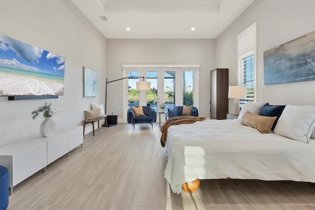 bedroom featuring access to exterior and french doors