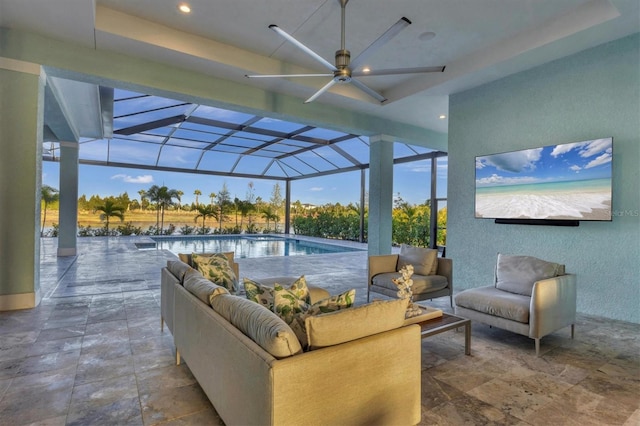 view of patio with an outdoor hangout area, ceiling fan, and a lanai