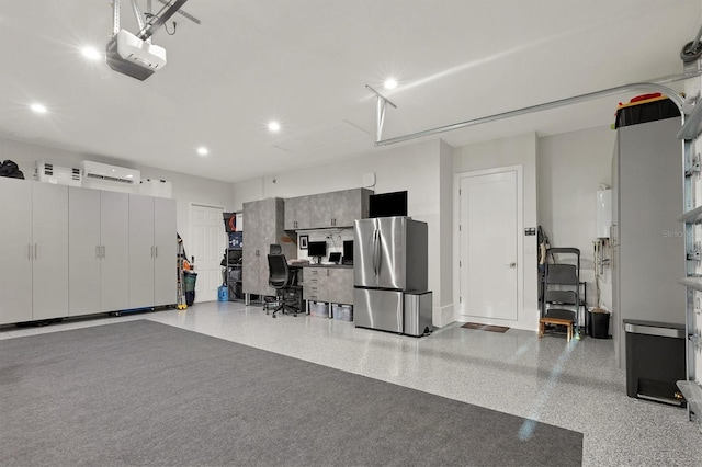 garage featuring stainless steel fridge and a garage door opener