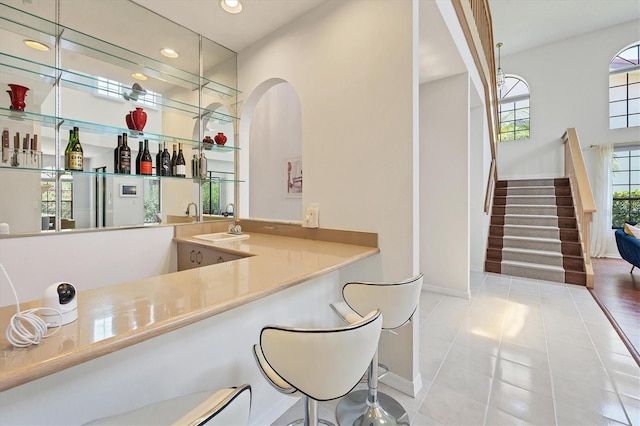 bar featuring tile patterned flooring