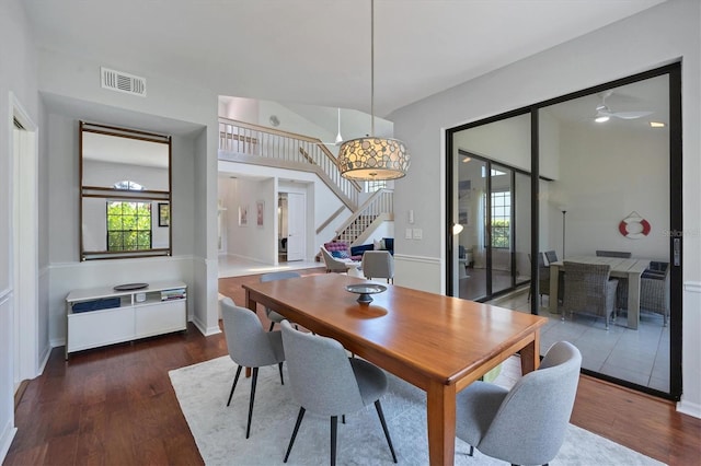 dining area featuring ceiling fan and dark hardwood / wood-style flooring