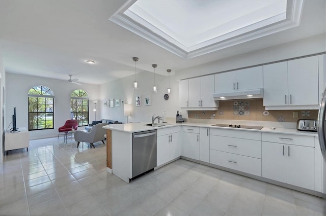 kitchen featuring pendant lighting, dishwasher, backsplash, ceiling fan, and kitchen peninsula